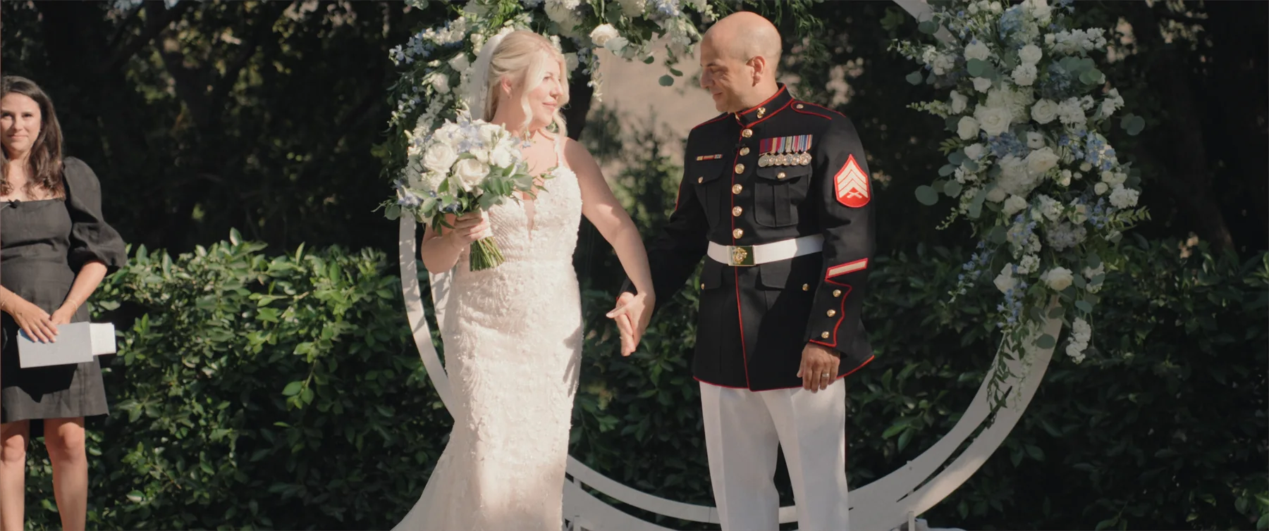 Vows beneath the floral arch