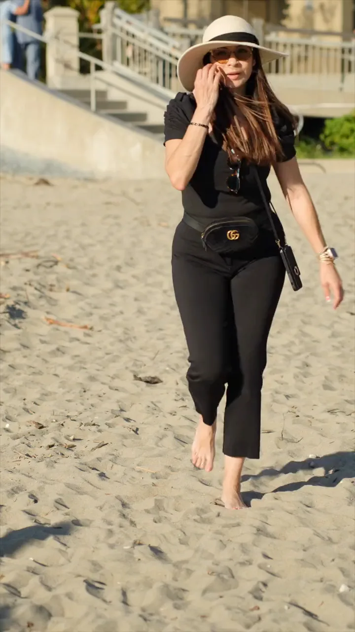 A wedding planner working on the beach with a headset