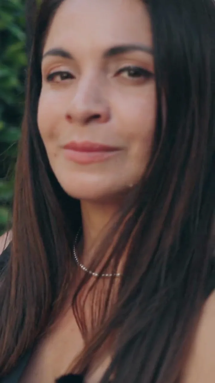 The wedding planner smiling to camera at the end of the day
